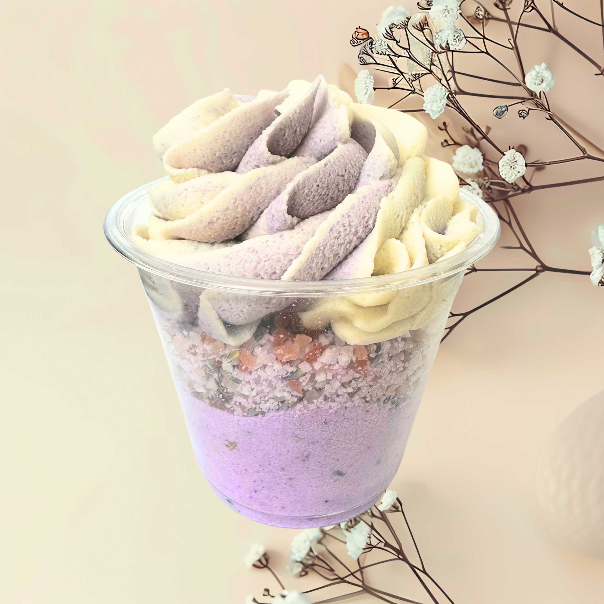 Colorful bubble bomb in a clear cup with a light background