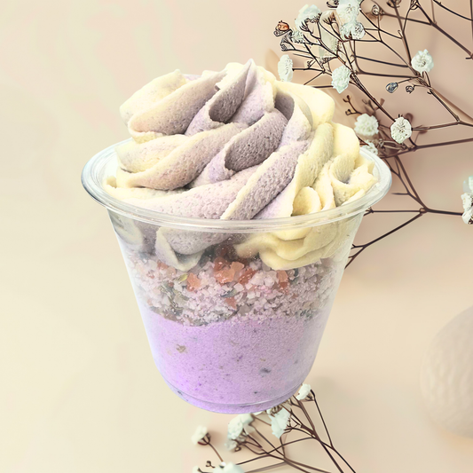 Colorful bubble bomb in a clear cup with a light background