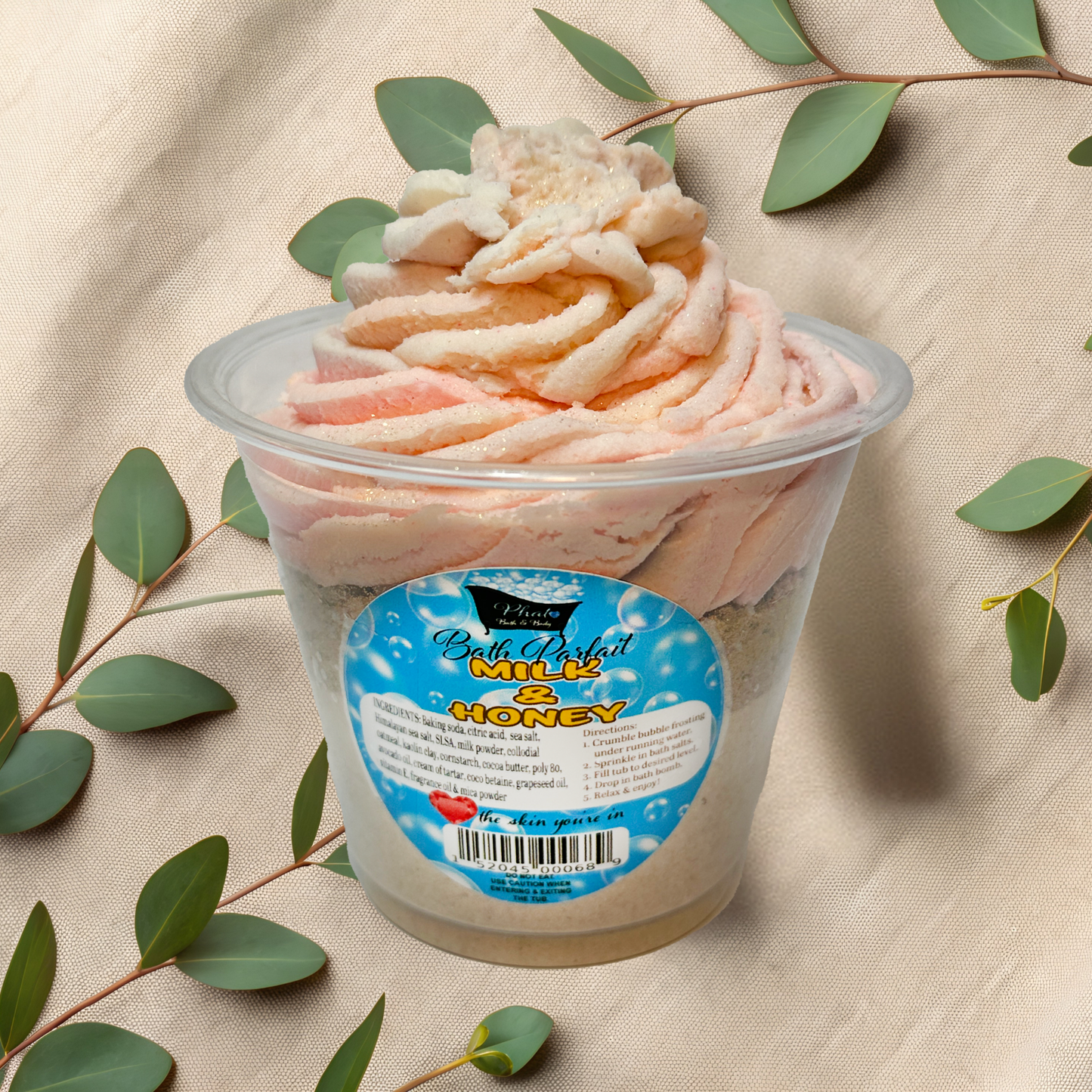 Bath Parfait with a label on a beige fabric background