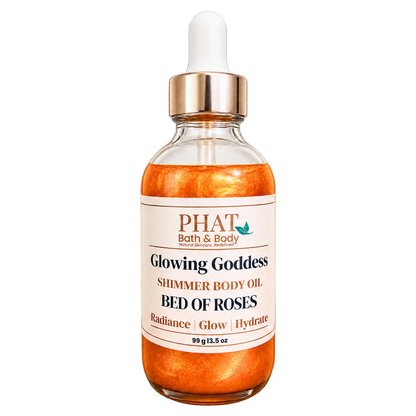 Phat Bath & Body Glowing Goddess Shimmer Body Oil in Bed of Roses, 3.5 oz glass dropper bottle with warm golden shimmer oil.