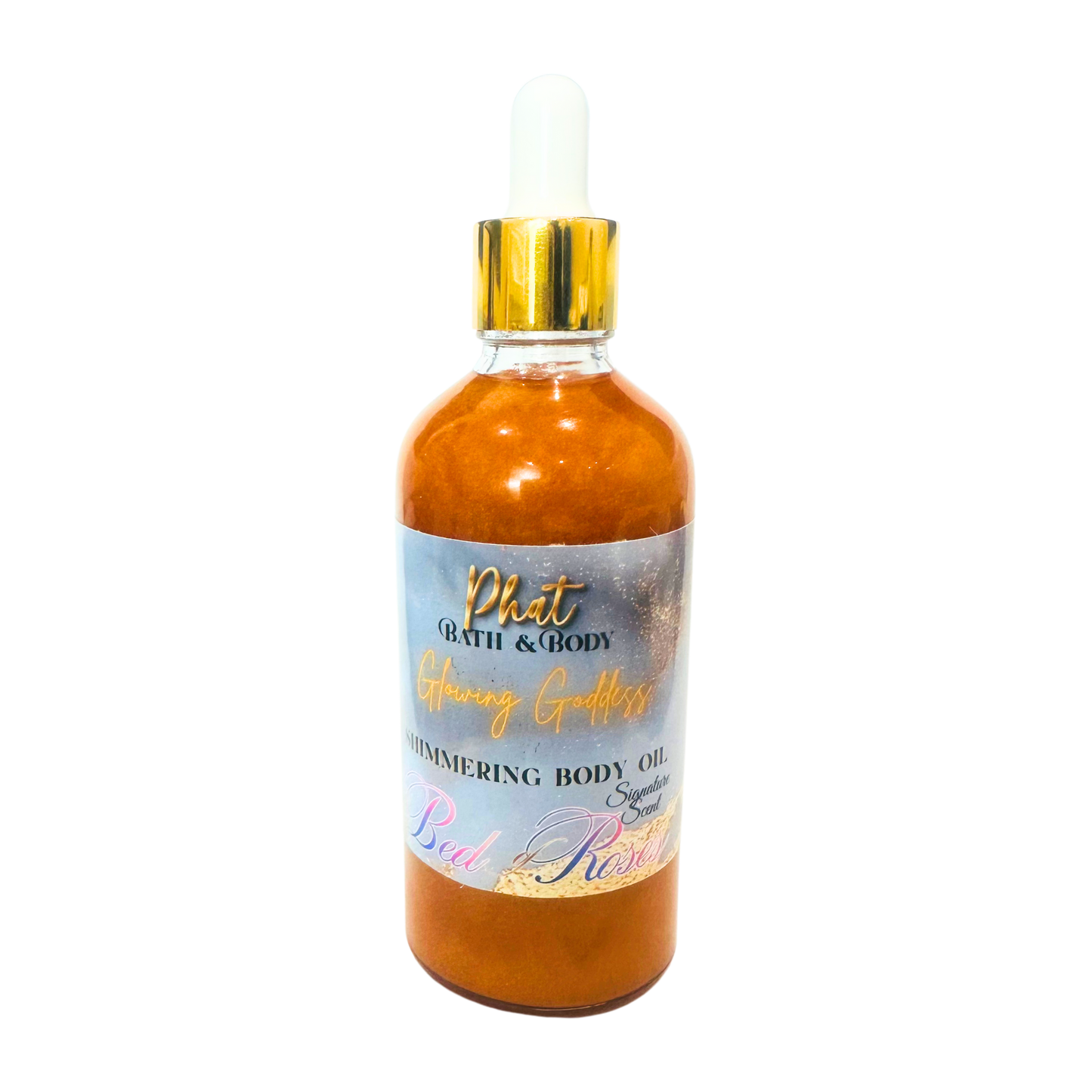 Bottle of shimmering body oil with a gold cap on a white background