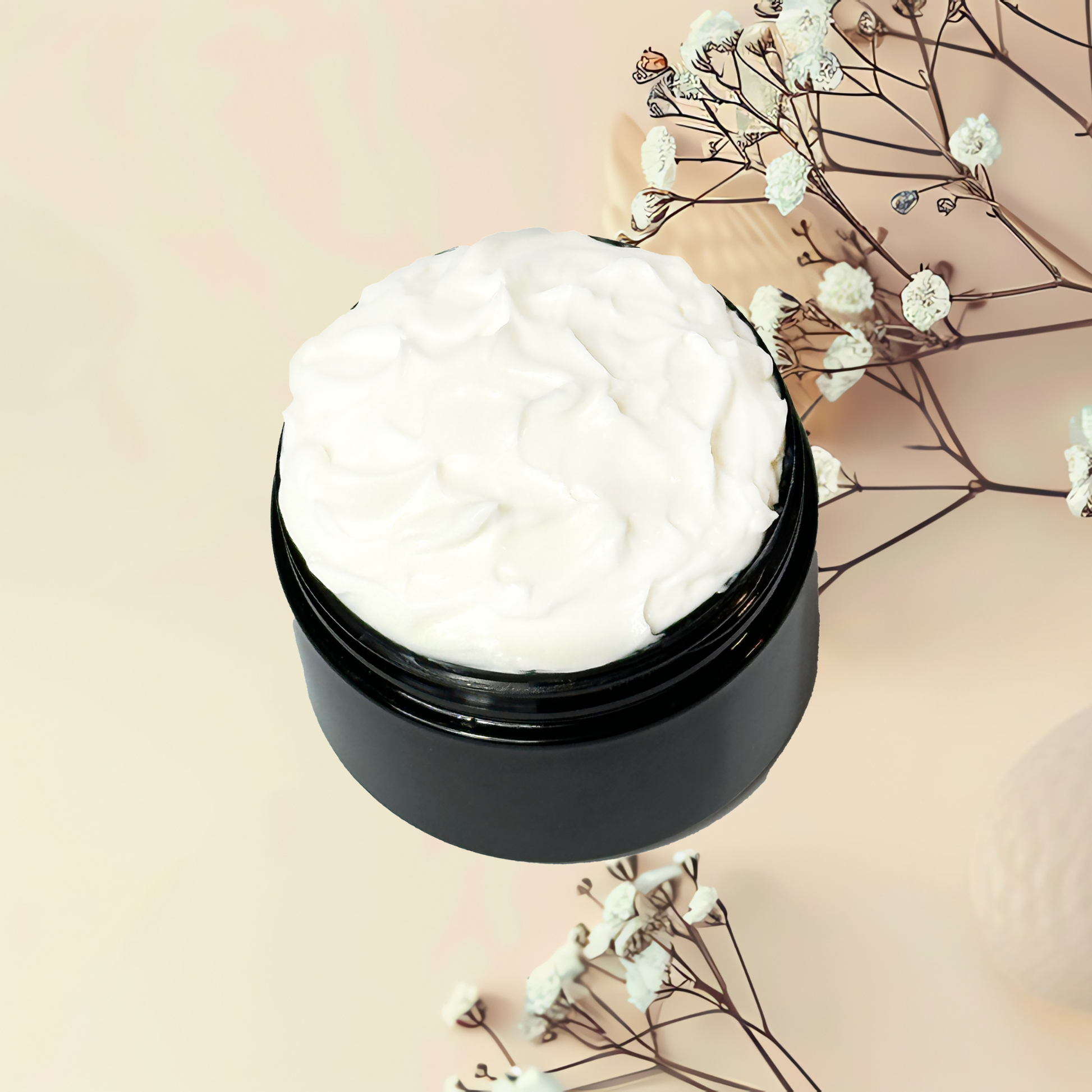 Black jar of white cream with dried flowers on a beige background