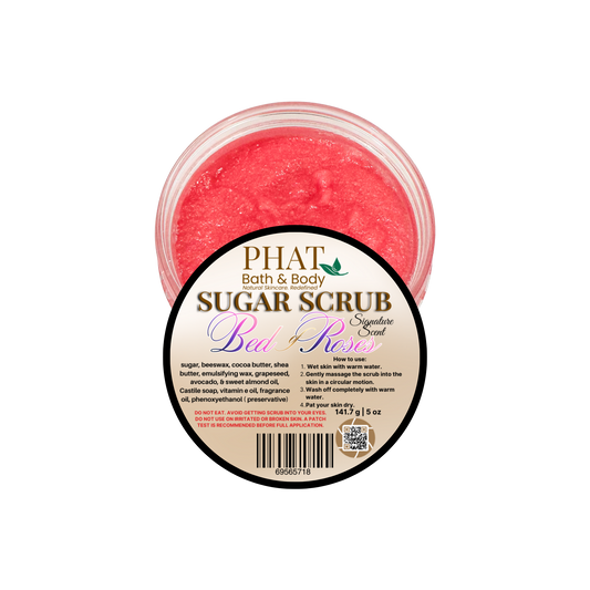 Pink sugar scrub in a container with a label on a white background