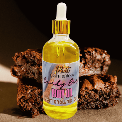 Bottle of body oil with a brownie-themed label in front of brownies