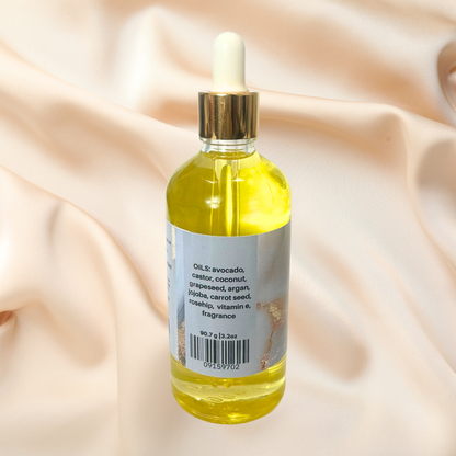 Bottle of yellow liquid with dropper on a beige fabric background