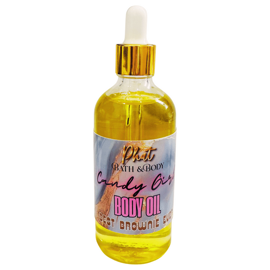 Bottle of body oil with a colorful label on a white background