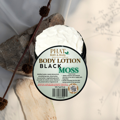 Body lotion container labeled 'Black Moss' by Phat Bath & Body on a natural stone background.