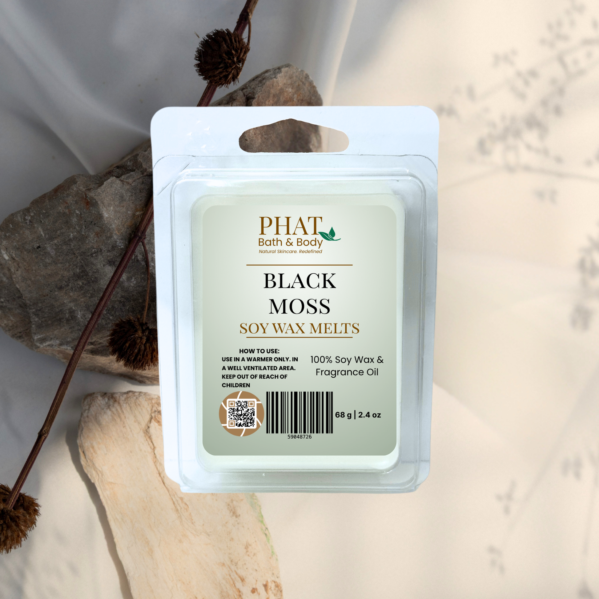 Pack of Phat Bath & Body Black Moss soy wax melts on a natural stone background