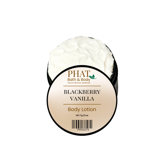 A round-labeled open jar of PHAT Bath & Body Blackberry Vanilla Body Lotion, showing a thick white lotion inside a black tub, on a plain white background.