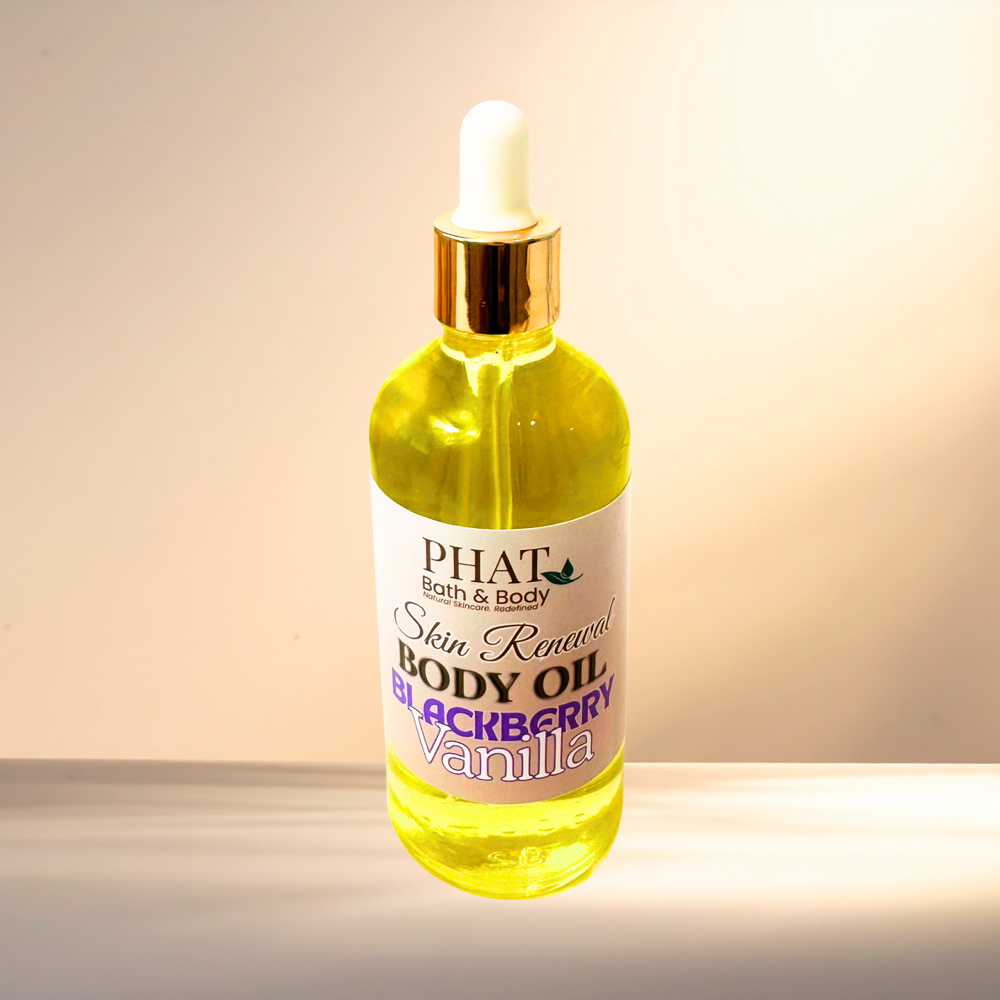 Bottle of Phat Bath & Body Blackberry Vanilla body oil on a gradient background