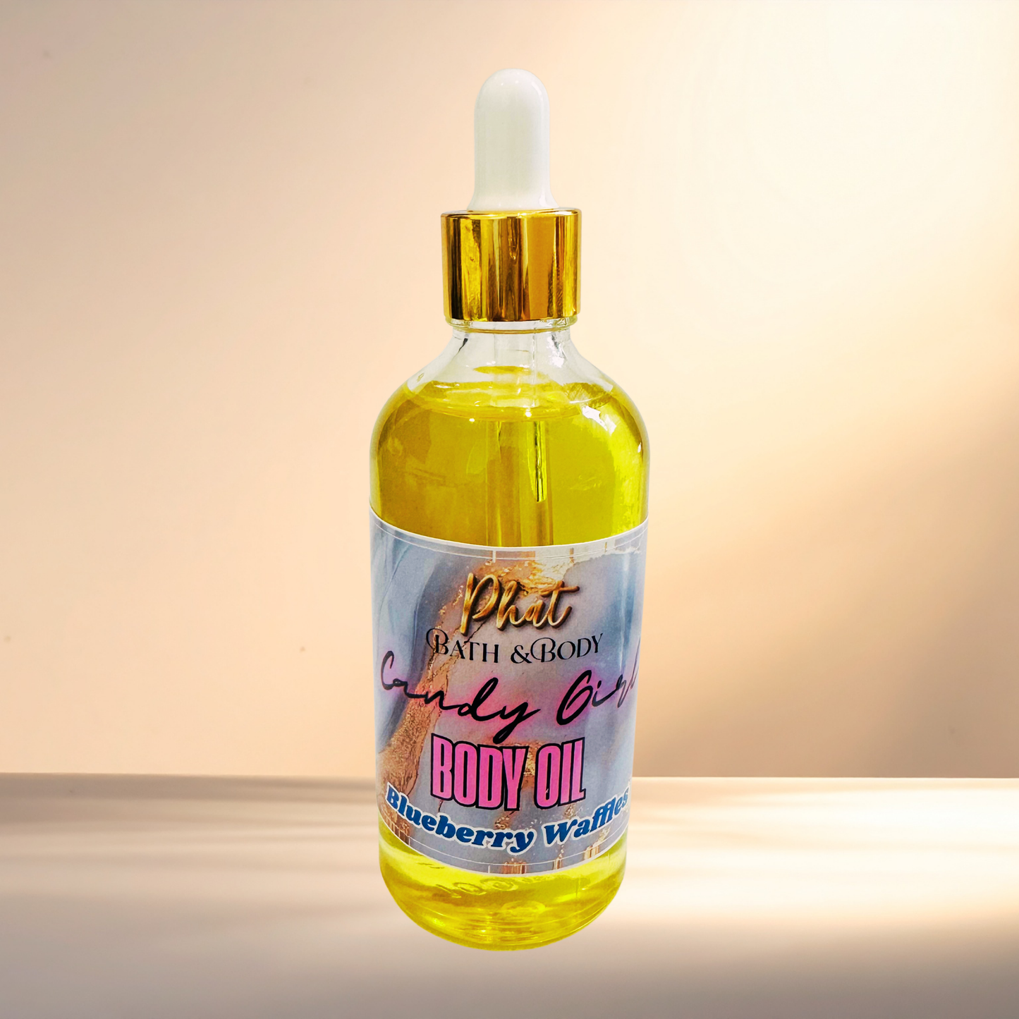 Bottle of body oil with a colorful label on a gradient background