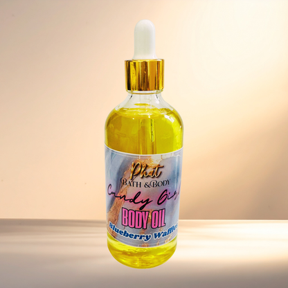 Bottle of body oil with a colorful label on a gradient background
