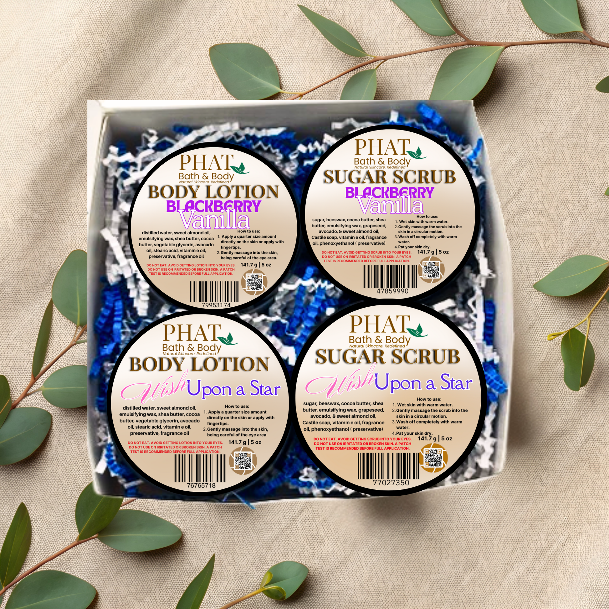 Box of Phat Bath & Body products including body lotion and sugar scrub with green leaves around.