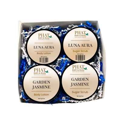 Set of Phat Bath & Body products including body lotions and sugar scrubs in a box.