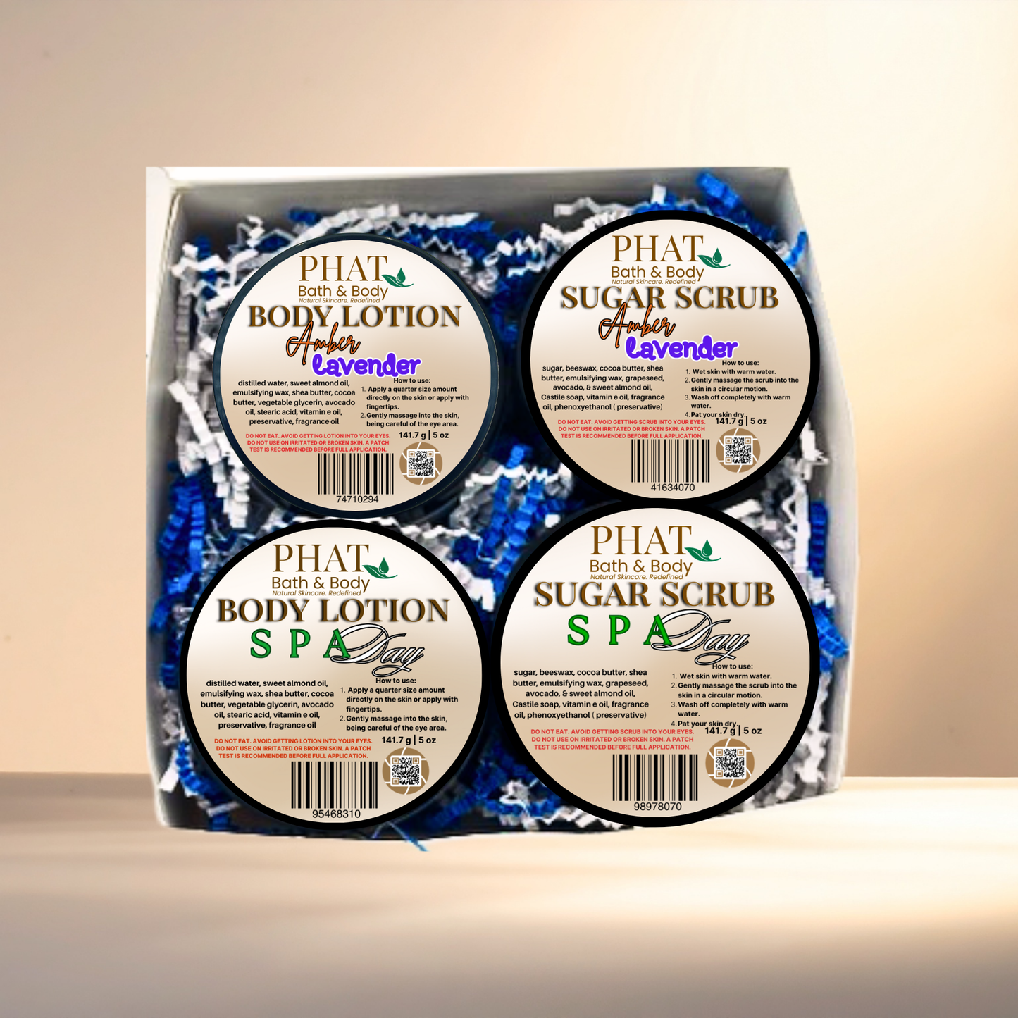 Set of Phat Bath & Body products including body lotion and sugar scrub in a box.