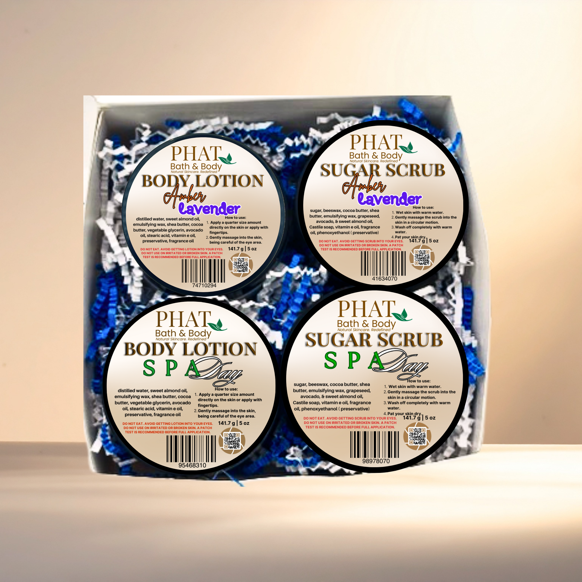 Set of Phat Bath & Body products including body lotion and sugar scrub in a box.
