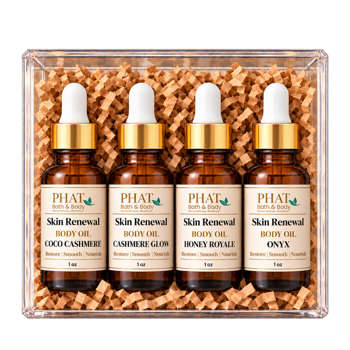Cashmere Collection body oil sampler featuring Coco Cashmere, Cashmere Glow, Honey Royale, and Onyx. Four individually bottled Skin Renewal Oils with warm, creamy, and sophisticated fragrances presented in a clear gift box.