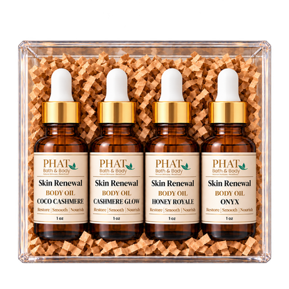 Cashmere Collection body oil sampler featuring Coco Cashmere, Cashmere Glow, Honey Royale, and Onyx. Four individually bottled Skin Renewal Oils with warm, creamy, and sophisticated fragrances presented in a clear gift box.