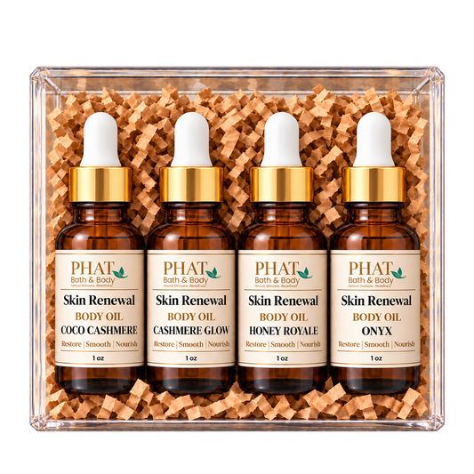 Cashmere Collection body oil sampler featuring Coco Cashmere, Cashmere Glow, Honey Royale, and Onyx. Four individually bottled Skin Renewal Oils with warm, creamy, and sophisticated fragrances presented in a clear gift box.