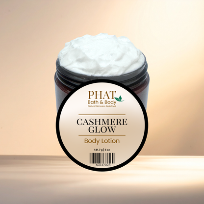 Jar of 'Cashmere Glow' body lotion with 'PHAT Bath & Body' label on a gradient background