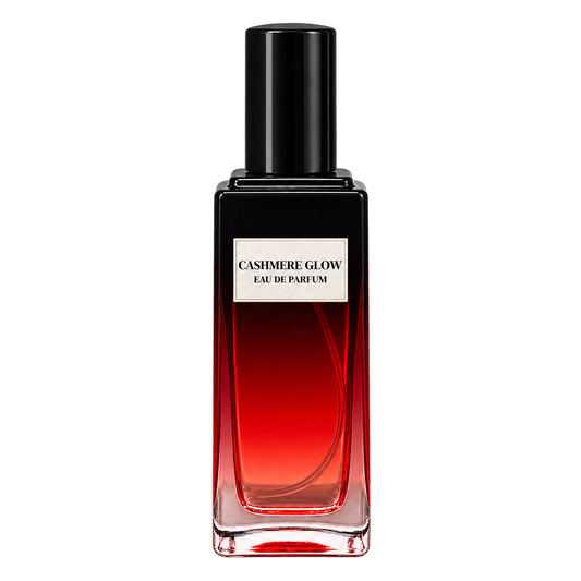 Phat Bath & Body Cashmere Glow Eau de Parfum in a tall clear glass bottle with black cap, warm tan label, and rich red-toned fragrance, shown as the main product image.