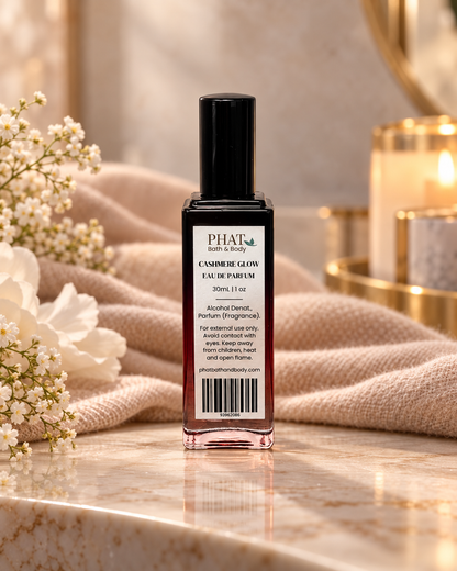Back label of the Cashmere Glow women’s Eau de Parfum bottle in a soft, warm luxury setting.