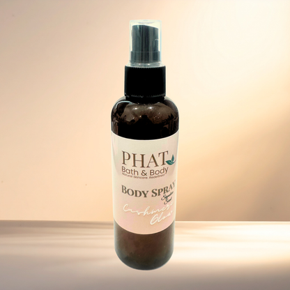 Body spray bottle with 'PHAT Bath & Body' label on a gradient background