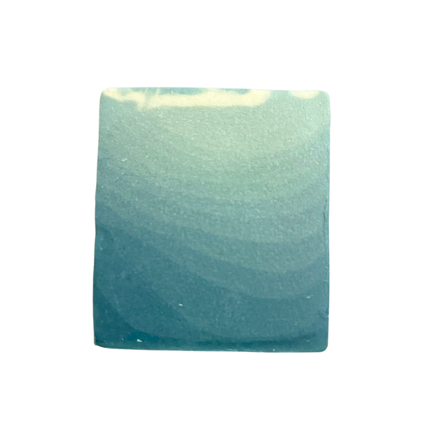 Greenish-blue square soap on a white background