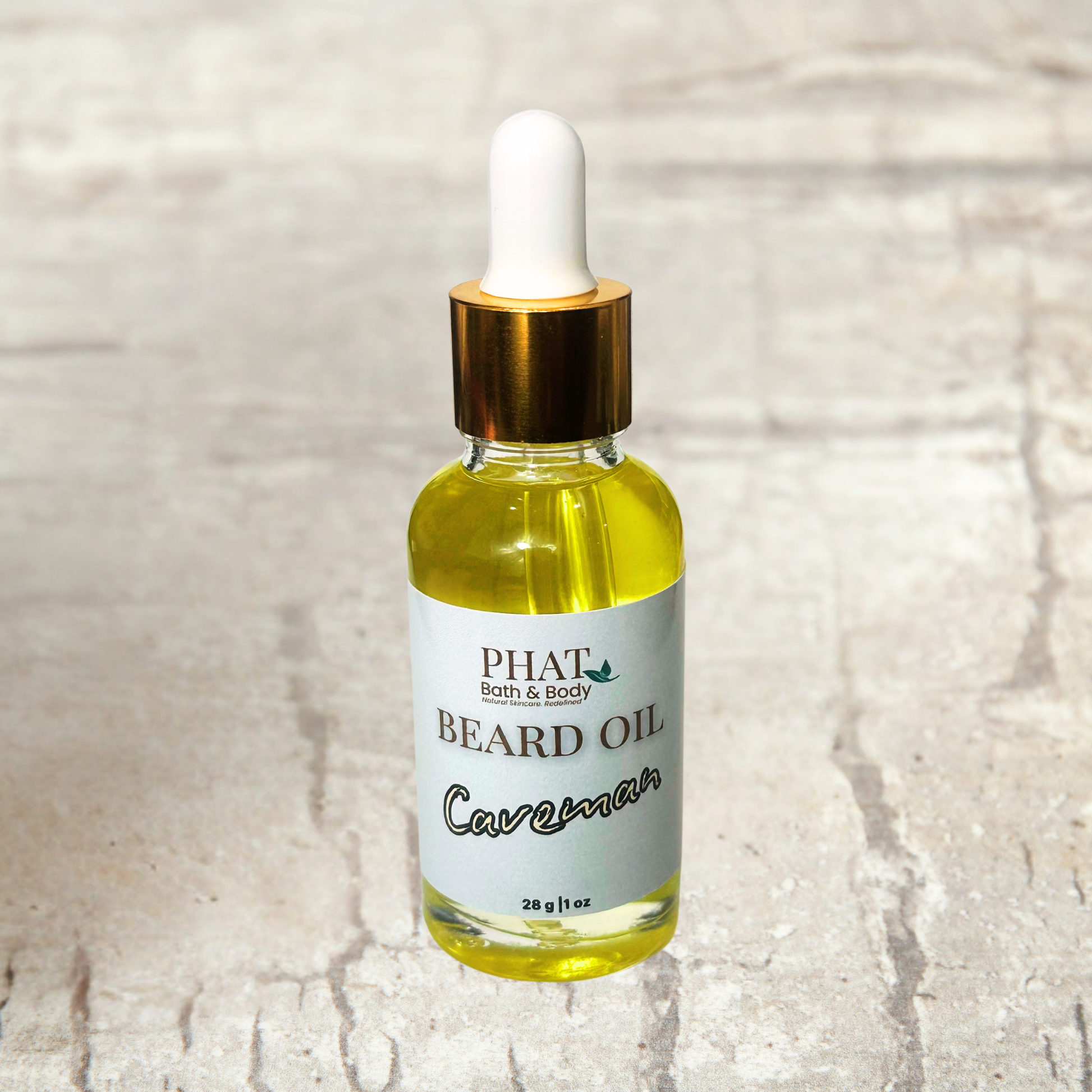 Bottle of Phat Bath & Body beard oil on a textured beige background