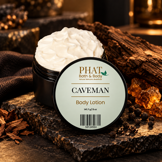Caveman Men’s Body Lotion displayed with dark stone, warm woods, amber accents, and black pepper in a refined masculine setting.