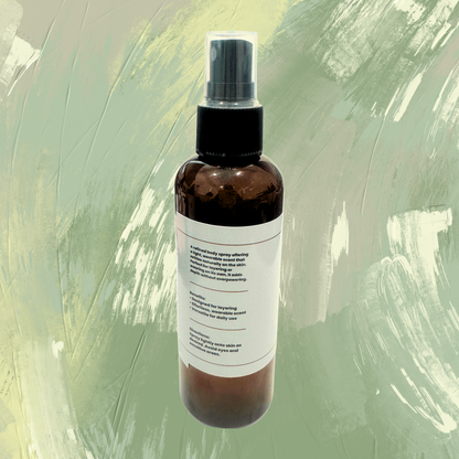 Brown spray bottle with a label on a green textured background
