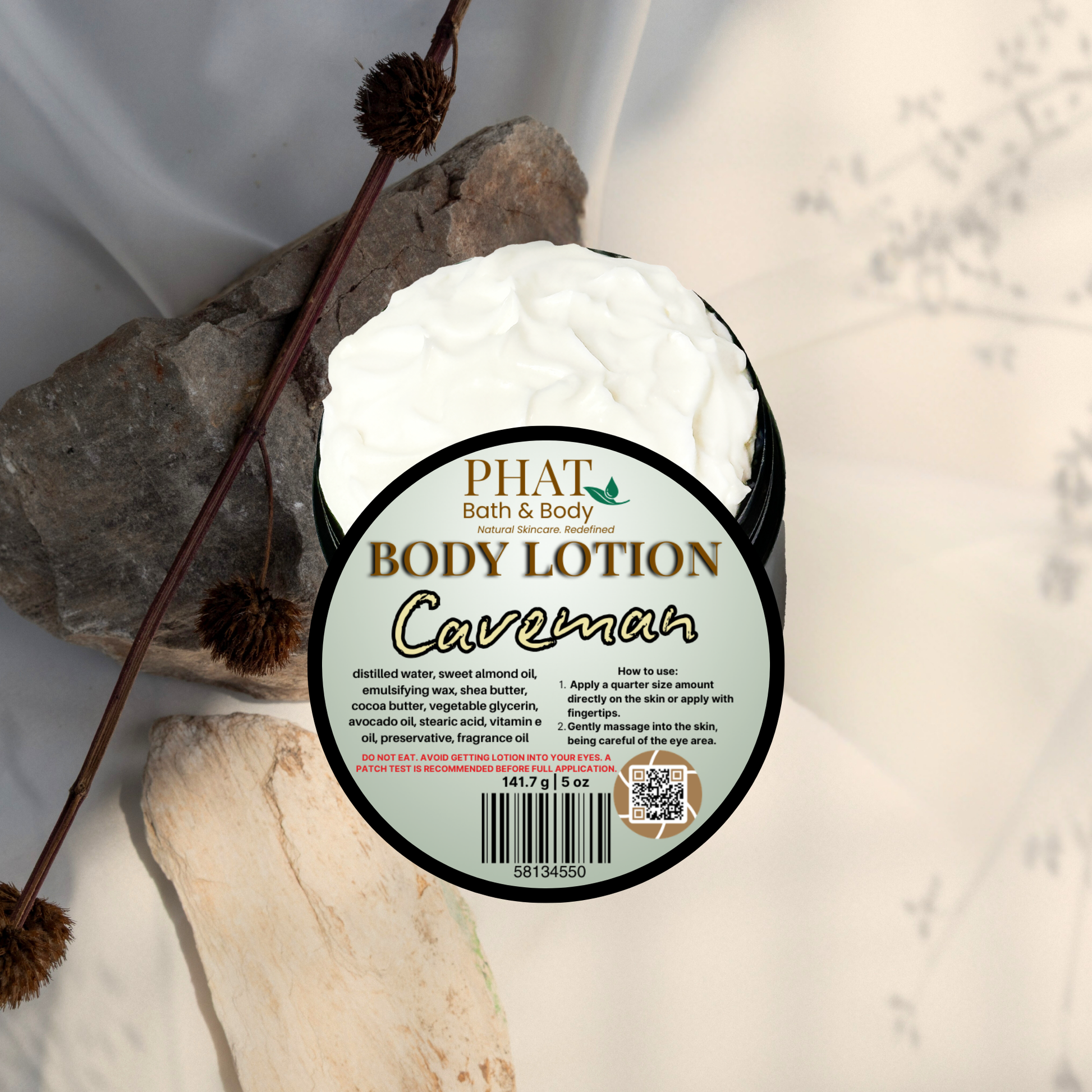 Body lotion container labeled 'Caveman' by Phat Bath & Body on a neutral background.