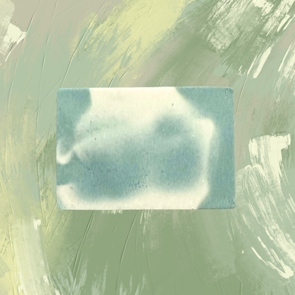 Rectangular bar of soap with a cloud pattern on a textured green background