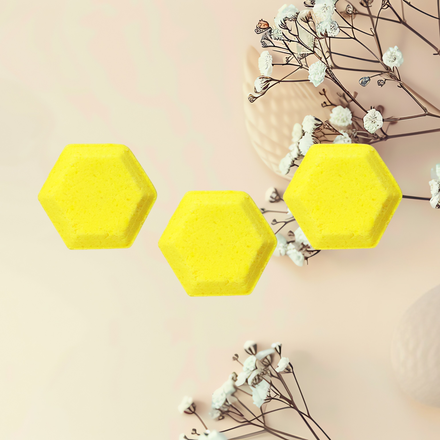 Three yellow hexagonal steamers on a light pink background with white flowers.