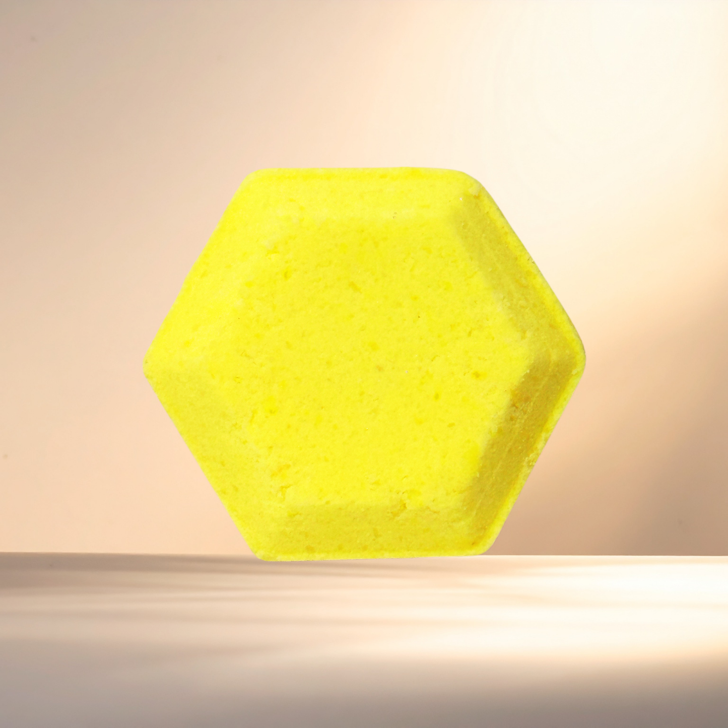 Hexagonal yellow steamer on a beige background