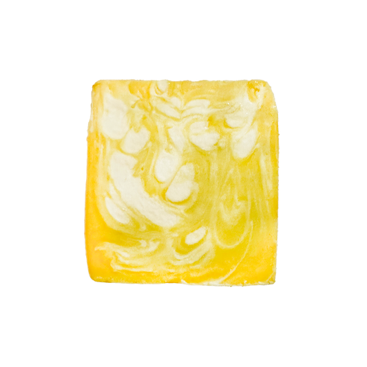 Marbled yellow and white soap bar on a white background