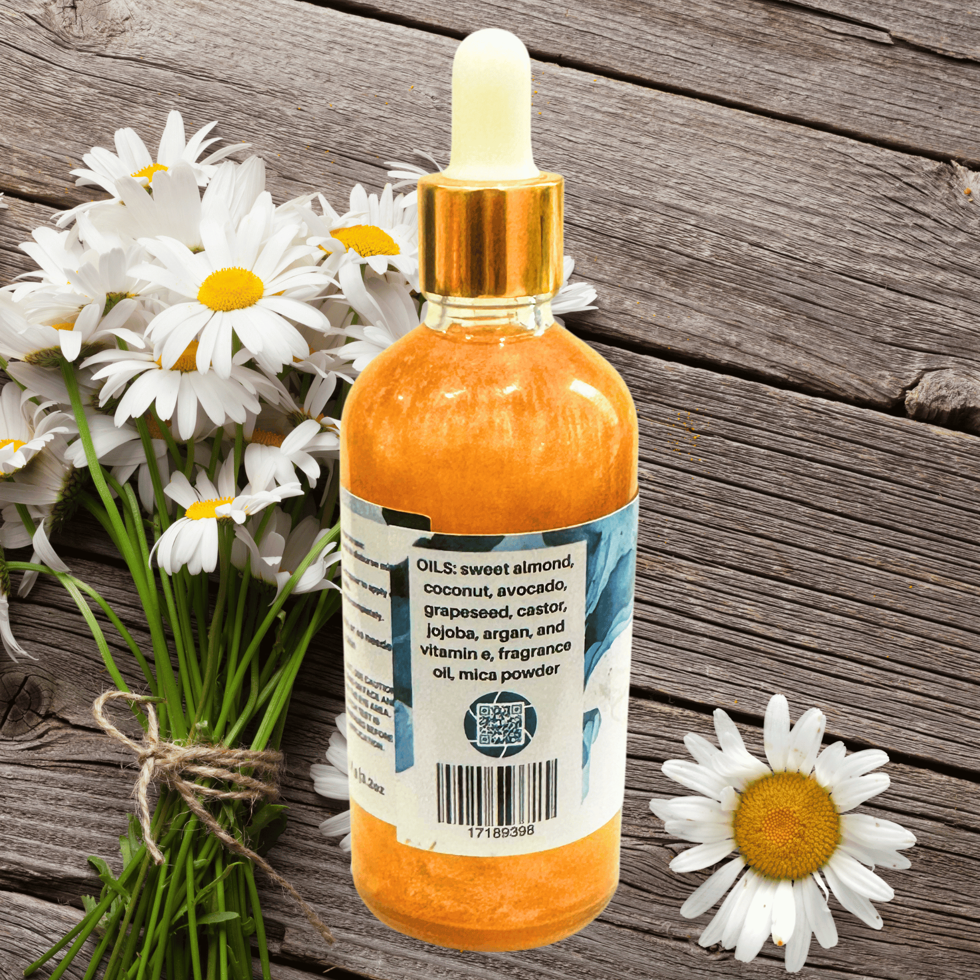 Bottle of shimmering body oil with dropper on a wooden surface with daisies