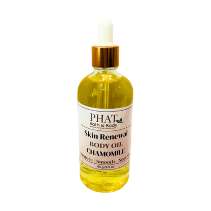 Bottle of PHAT Bath & Body Skin Renewal Body Oil Chamomile on a white background