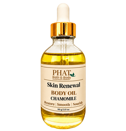 Phat Bath & Body Chamomile Skin Renewal Body Oil, 3.5 oz golden body oil in a clear glass dropper bottle with a gold cap and cream label.