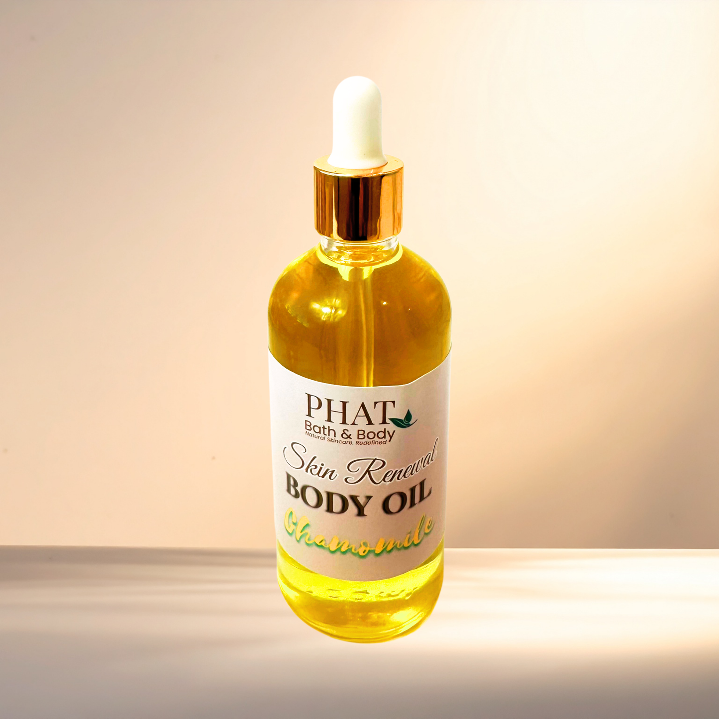 Bottle of PHAT Bath & Body Skin Renewal Body Oil with dropper on a gradient background