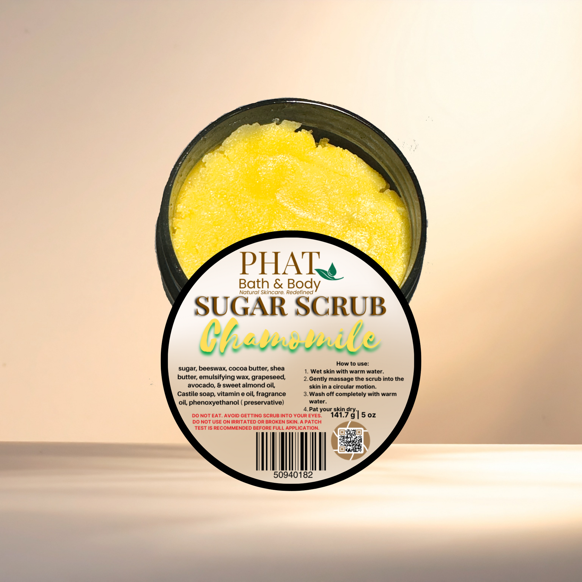 Jar of Phat Bath & Body Chamomile sugar scrub on a beige background