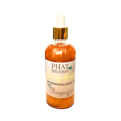 Bottle of 'PHAT Bath & Body' shimmering body oil with a gold top on a white background