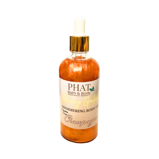 Bottle of 'PHAT Bath & Body' shimmering body oil with a gold top on a white background