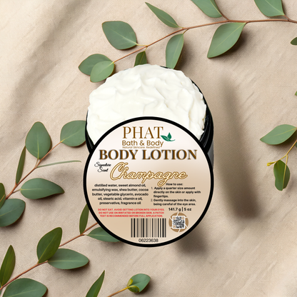 Body lotion container labeled 'PHAT Bath & Body' with green leaves on a beige fabric background