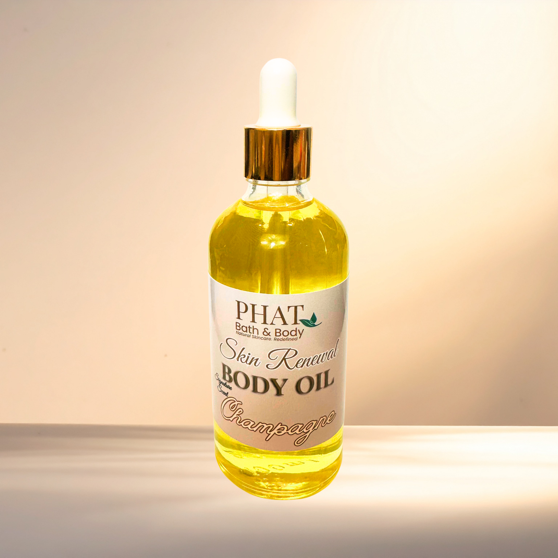 Bottle of PHAT Bath & Body Skin Renewal Body Oil on a gradient background