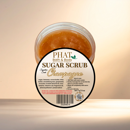Jar of sugar scrub labeled 'PHAT Bath & Body Sugar Scrub Champagne' on a light background
