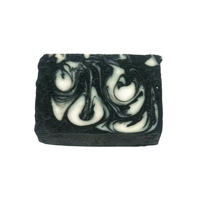 Black and white swirled soap bar on a white background