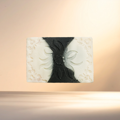 Decorative soap with black and white design on a beige background