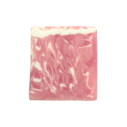 Pink and white swirled soap bar on a white background