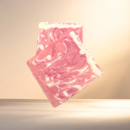 Pink marbled soap on a light background